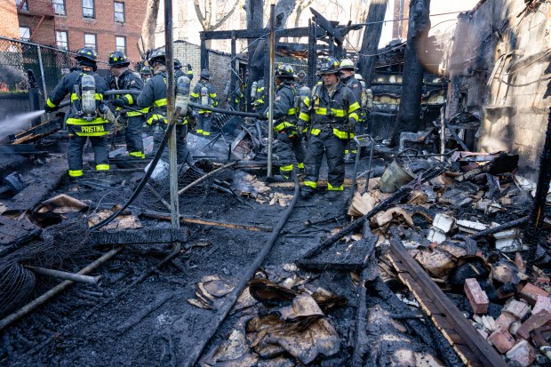 A two-alarm fire ripped through multiple commercial buildings on Woodhaven Blvd. in Middle Village, Queens on Saturday, Nov. 30, 2024. (Theodore Parisienne / New York Daily News)